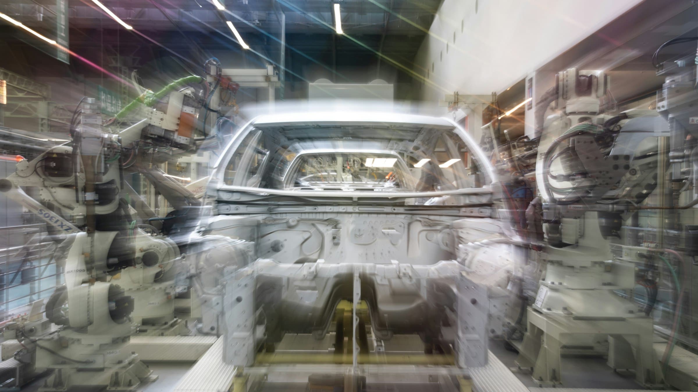 Robotic arms working along an automated production line