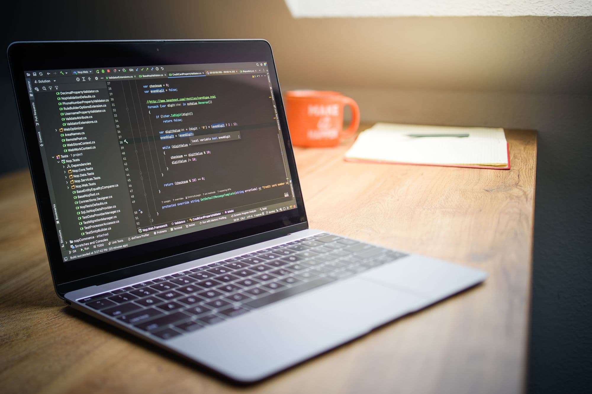 A dark-themed code editor open on a laptop