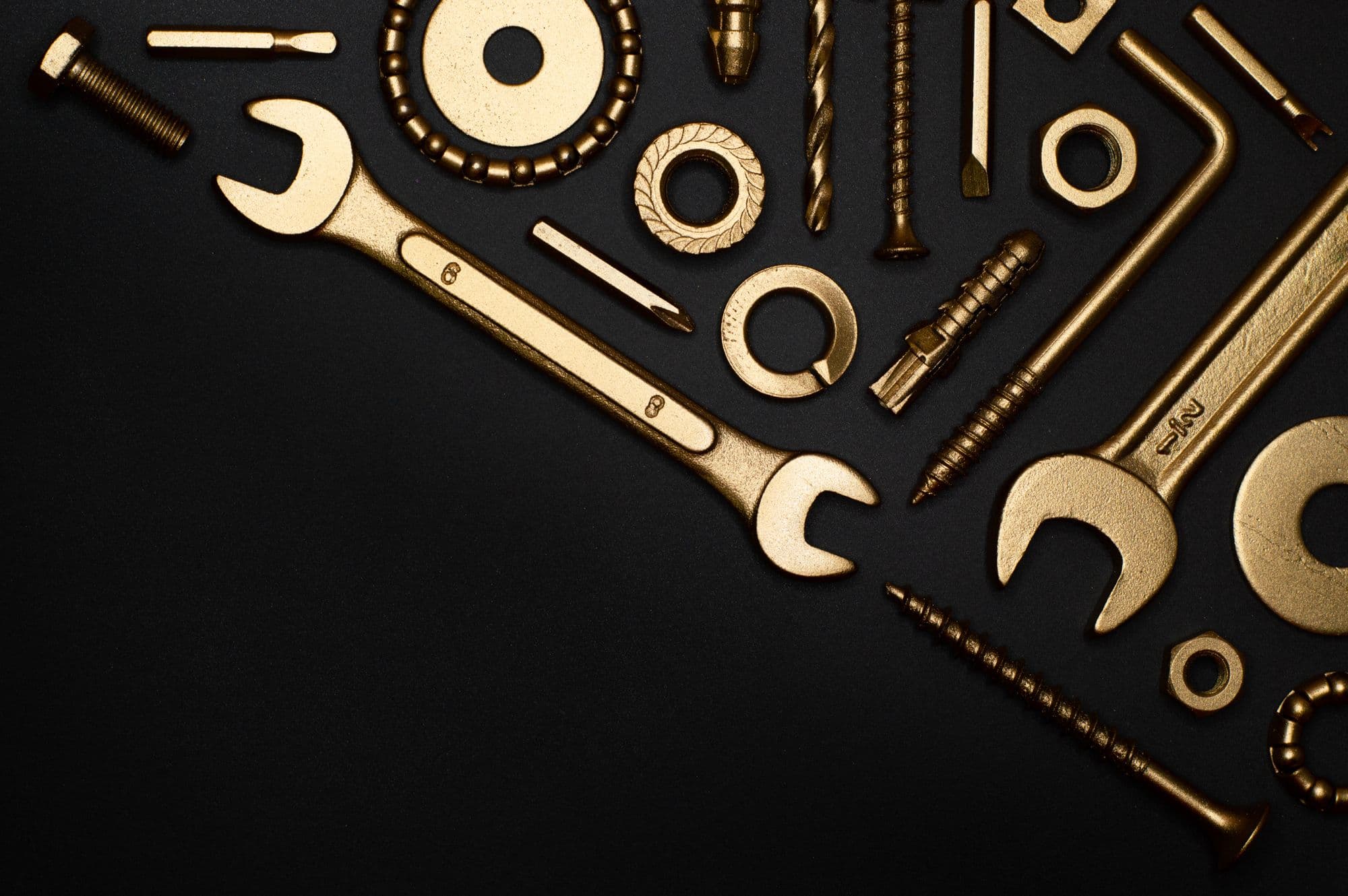 A flat-lay of hand tools and hardware
