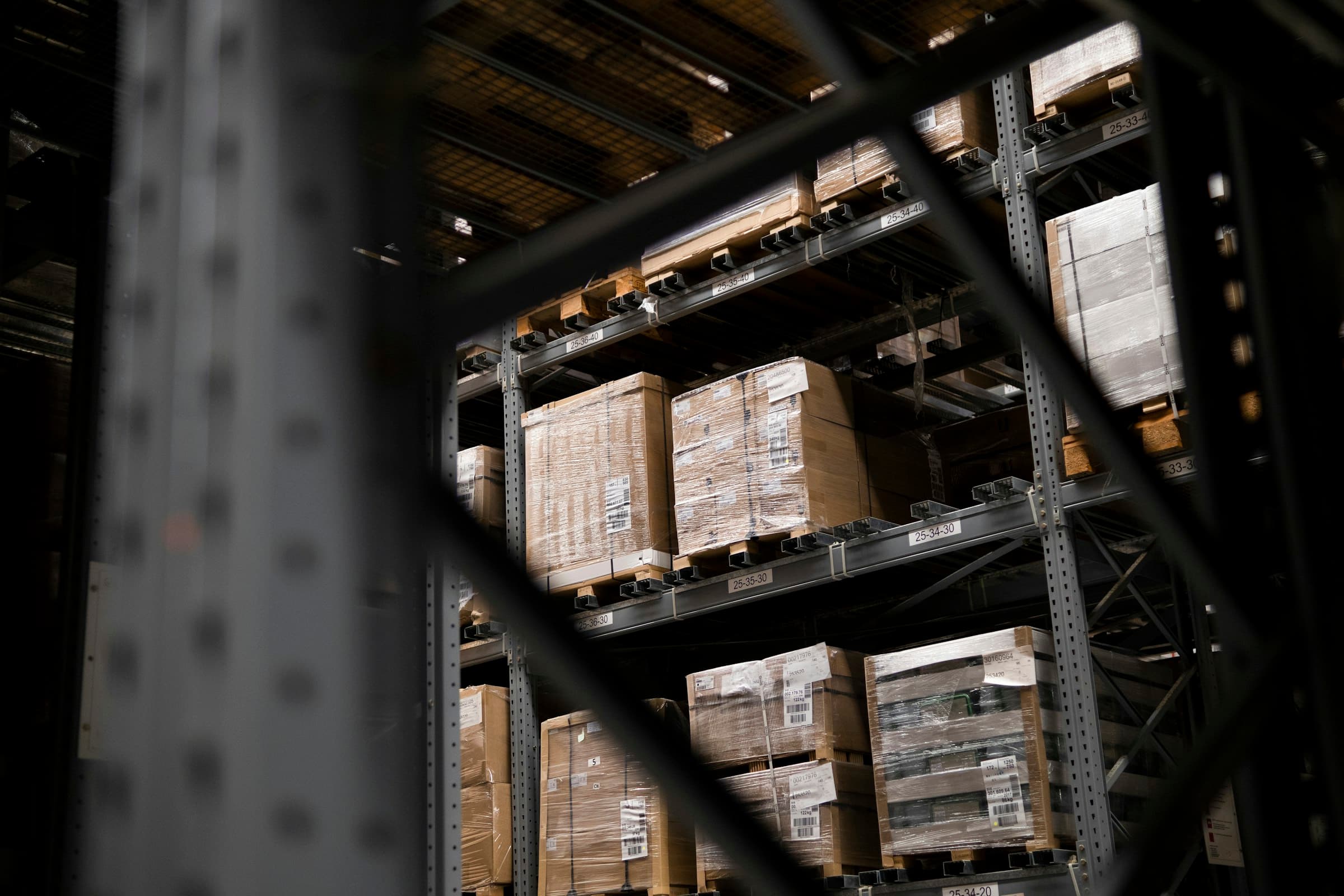 Pallets of packaged goods staged in a wholesale showroom warehouse